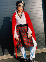 Women's vintage retro 1990's mini length plaid print wrap skirt in red, grey, black, and yellow. Acrylic material. Fringe edge, elastic waistband. 