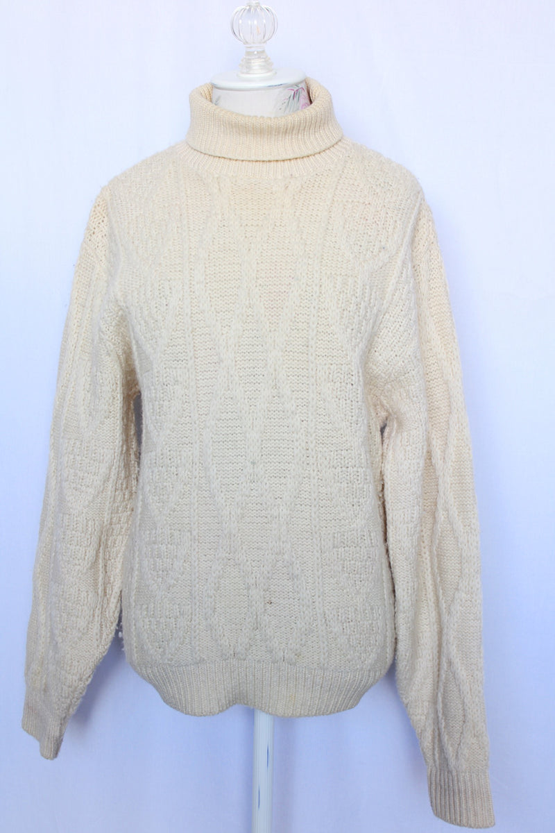 Women's or men's vintage 1970's Towne and King, LTD label long sleeve cream colored cable knit pullover sweater with a fold over turtleneck.