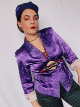 Women's vintage 1950's long sleeve reversible satin open jacket in bright purple and light lavender. Side slits, front pockets and small shoulder pads